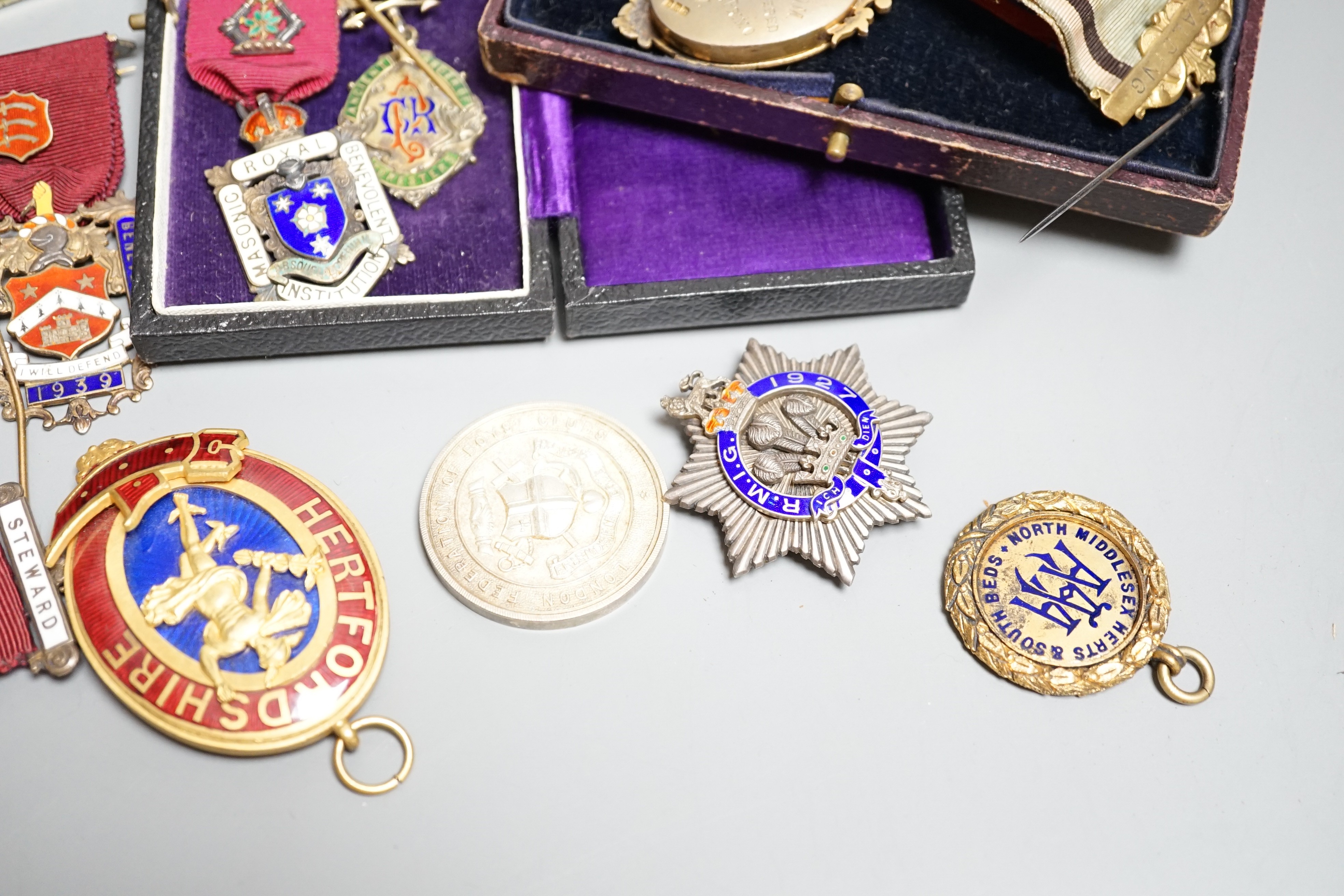 A collection of silver or gilt metal and enamel Masonic medals